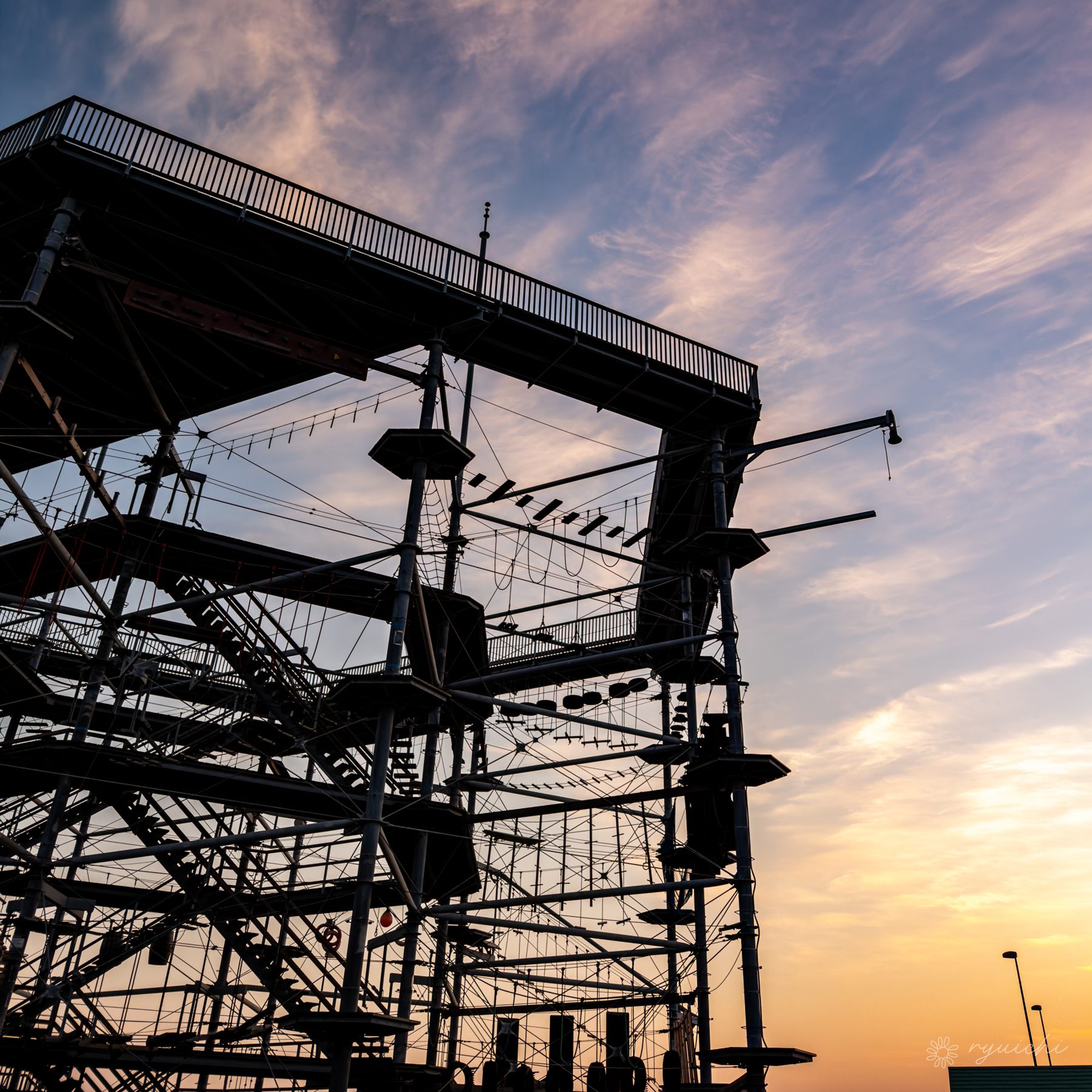 Steel structure silhouetted against dusk